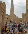Photo caption: Summer Institute group together with Laziz Otayarov, the Uzbek guide and Professor Frank Griffel in front of the minaret of the Islam-Khoja madrasa in Khiva. Built in 1910 to a height of 185 feet, it is still one of the tallest buildings in Central Asia.