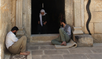 People sitting in a doorway